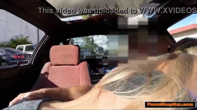 Blonde babe gives the pawnshop owner a blowjob in her car